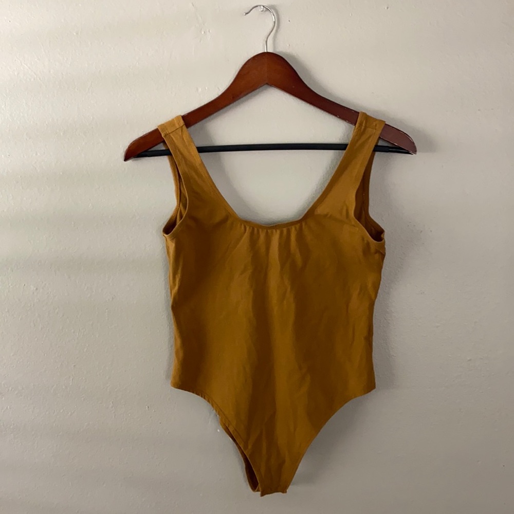 Mangopop mustard colored bodysuit.